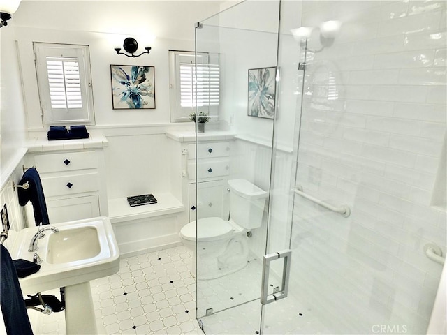 4719 E E Colorado St, Long Beach, CA 90814 - bathroom featuring a shower stall and a wainscoted wall