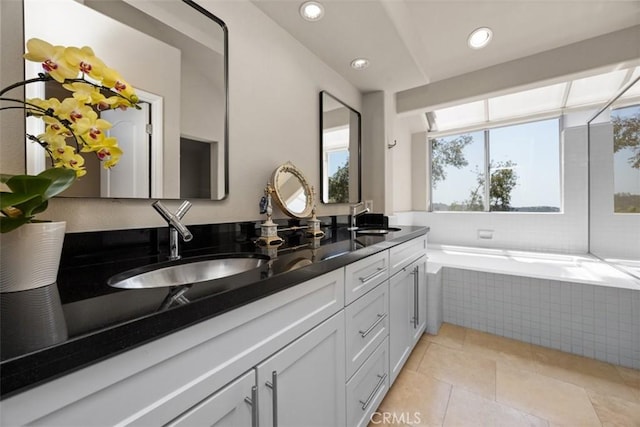 1872 Caminito De La Narcissa, Glendale, CA 91208 - bathroom with double vanity, a relaxing tiled tub, tile patterned floors, and recessed lighting