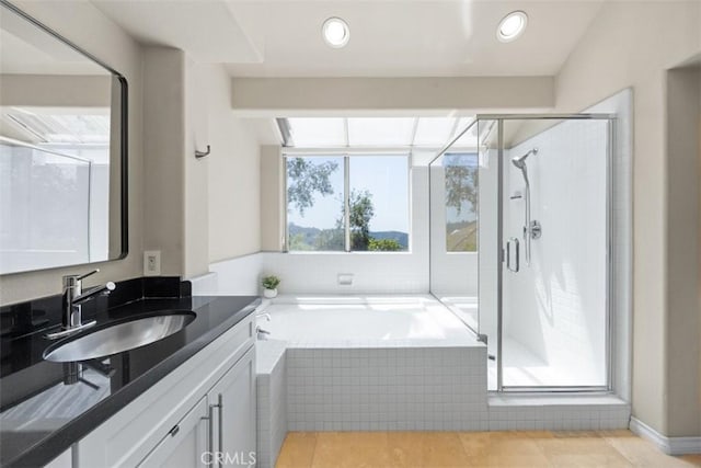 1872 Caminito De La Narcissa, Glendale, CA 91208 - bathroom with vanity, a bath, a stall shower, tile patterned floors, and recessed lighting