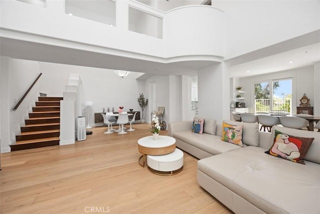 1872 Caminito De La Narcissa, Glendale, CA 91208 - living room with stairs, light wood-type flooring, a towering ceiling, and recessed lighting