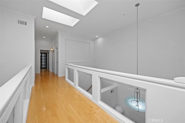 1872 Caminito De La Narcissa, Glendale, CA 91208 - corridor with a skylight, crown molding, light wood-style flooring, and recessed lighting
