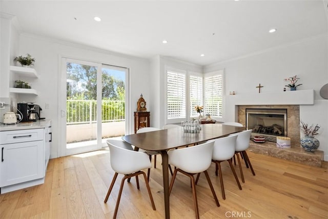 1872 Caminito De La Narcissa, Glendale, CA 91208 - dining space with crown molding, light wood-type flooring, a glass covered fireplace, and recessed lighting