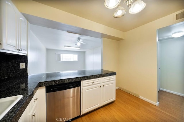 981 S St Andrews Pl Unit 104, Los Angeles, CA 90019 - kitchen with dishwasher, tile counters, light wood-type flooring, and white cabinets