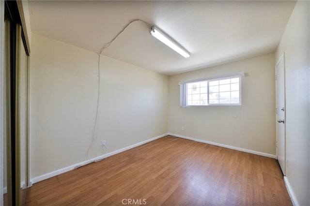 981 S St Andrews Pl Unit 104, Los Angeles, CA 90019 - spare room with light wood-type flooring and baseboards
