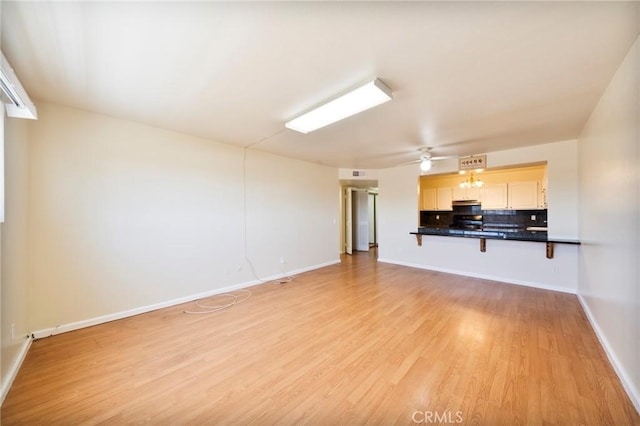 981 S St Andrews Pl Unit 104, Los Angeles, CA 90019 - unfurnished living room with light wood-type flooring and a ceiling fan