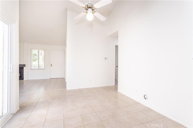 19533 Rinaldi St Unit 48, Porter Ranch, CA 91326 - unfurnished room featuring high vaulted ceiling, ceiling fan, light tile patterned floors, and a fireplace