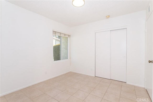 19533 Rinaldi St Unit 48, Porter Ranch, CA 91326 - unfurnished bedroom featuring a closet and baseboards