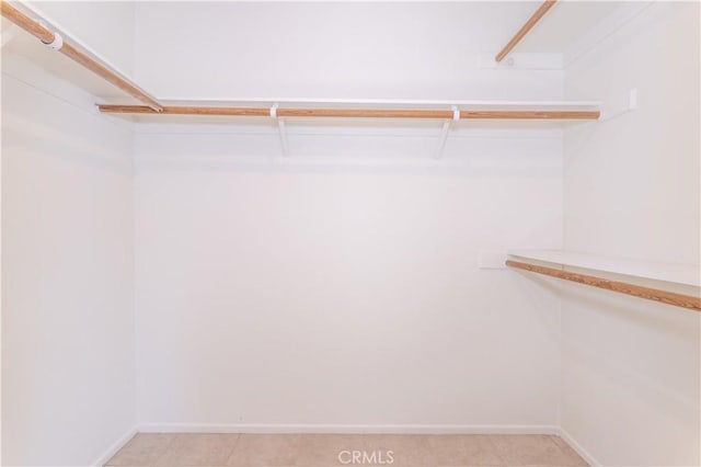 19533 Rinaldi St Unit 48, Porter Ranch, CA 91326 - spacious closet featuring light tile patterned floors