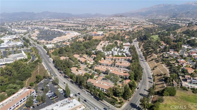 19533 Rinaldi St Unit 48, Porter Ranch, CA 91326 - aerial overview of property's location with a mountain backdrop and a main thoroughfare