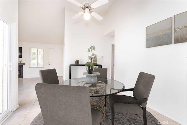 19533 Rinaldi St Unit 48, Porter Ranch, CA 91326 - dining space with light tile patterned floors, ceiling fan, and a towering ceiling