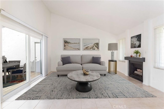 19533 Rinaldi St Unit 48, Porter Ranch, CA 91326 - tiled living room with vaulted ceiling and a fireplace
