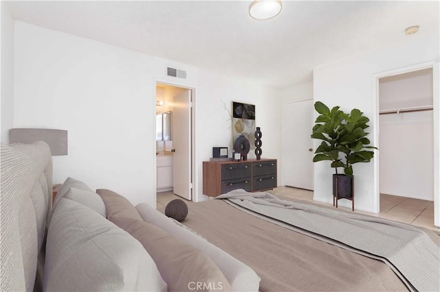 19533 Rinaldi St Unit 48, Porter Ranch, CA 91326 - bedroom featuring connected bathroom, a walk in closet, and a closet