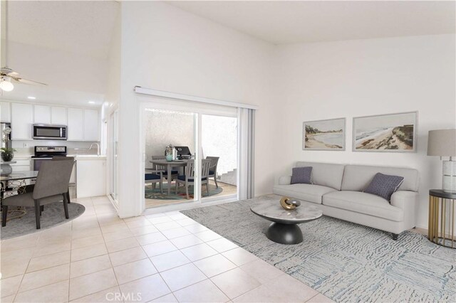 19533 Rinaldi St Unit 48, Porter Ranch, CA 91326 - living room with a ceiling fan, light tile patterned floors, and a high ceiling