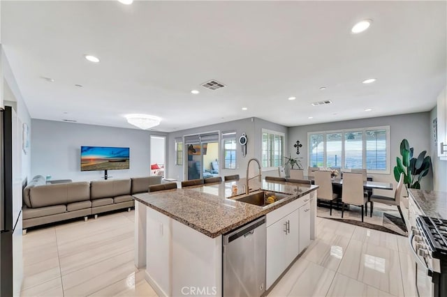 18348 Cachet Way, Canyon Country, CA 91350 - kitchen featuring appliances with stainless steel finishes, light tile patterned floors, stone counters, plenty of natural light, and recessed lighting