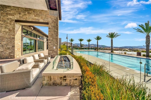 18348 Cachet Way, Canyon Country, CA 91350 - community pool featuring an outdoor living space with a fire pit, a mountain view, and a patio area