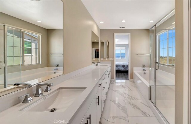 18348 Cachet Way, Canyon Country, CA 91350 - full bath with connected bathroom, marble tiled flooring, healthy amount of natural light, double vanity, and recessed lighting