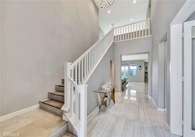 18348 Cachet Way, Canyon Country, CA 91350 - staircase with a high ceiling, recessed lighting, and a chandelier