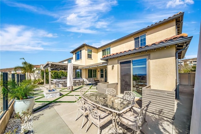 18348 Cachet Way, Canyon Country, CA 91350 - rear view of property featuring stucco siding, outdoor dining area, a patio, and a tile roof