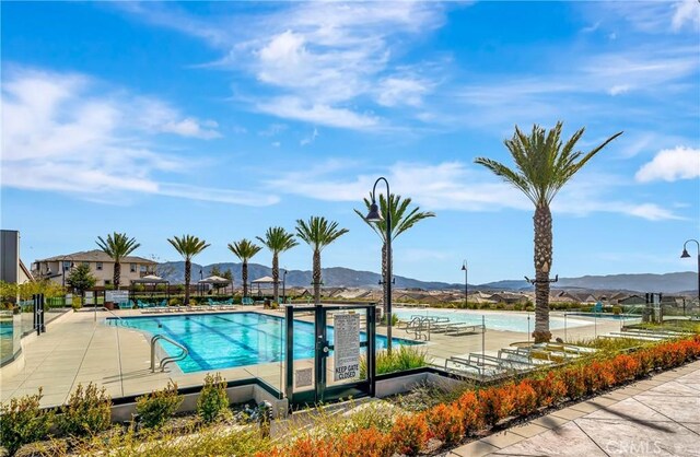 18348 Cachet Way, Canyon Country, CA 91350 - community pool featuring a mountain view and a patio