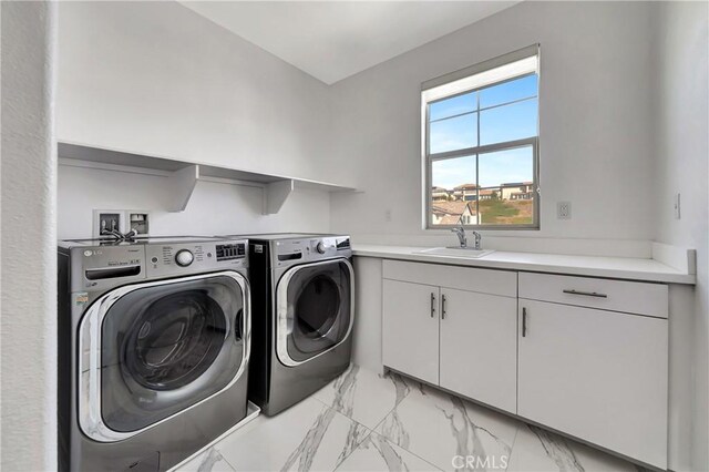18348 Cachet Way, Canyon Country, CA 91350 - laundry room with light marble finish flooring, washer and dryer, and cabinet space