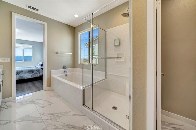 18348 Cachet Way, Canyon Country, CA 91350 - ensuite bathroom featuring a bath, a shower stall, recessed lighting, and marble finish floors