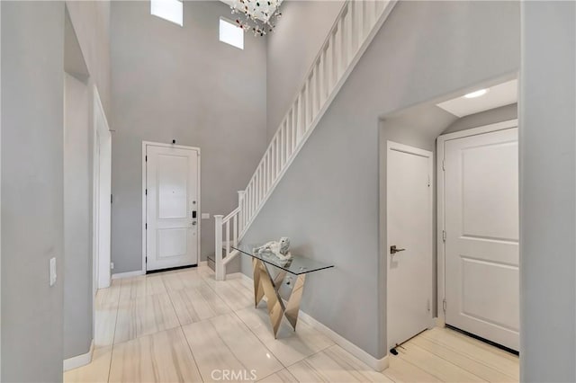 18348 Cachet Way, Canyon Country, CA 91350 - entrance foyer with stairs, a towering ceiling, and a chandelier