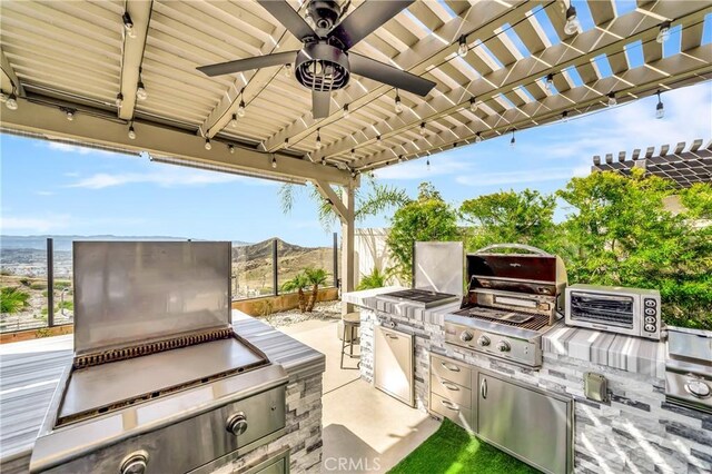 18348 Cachet Way, Canyon Country, CA 91350 - view of patio featuring an outdoor kitchen, a ceiling fan, and a pergola