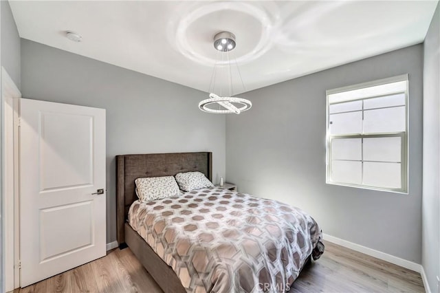 18348 Cachet Way, Canyon Country, CA 91350 - bedroom with wood finished floors and a chandelier