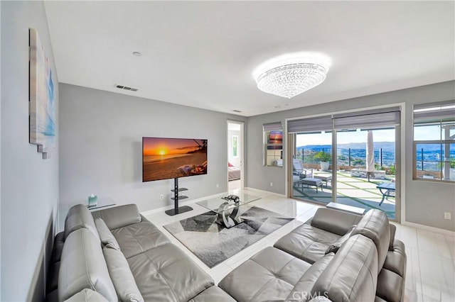 18348 Cachet Way, Canyon Country, CA 91350 - living room with light tile patterned floors and a chandelier