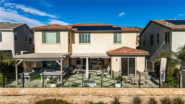 18348 Cachet Way, Canyon Country, CA 91350 - back of property with a tile roof, solar panels, a patio, and stucco siding