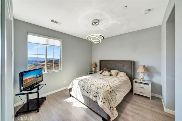 18348 Cachet Way, Canyon Country, CA 91350 - bedroom with light wood-type flooring and baseboards