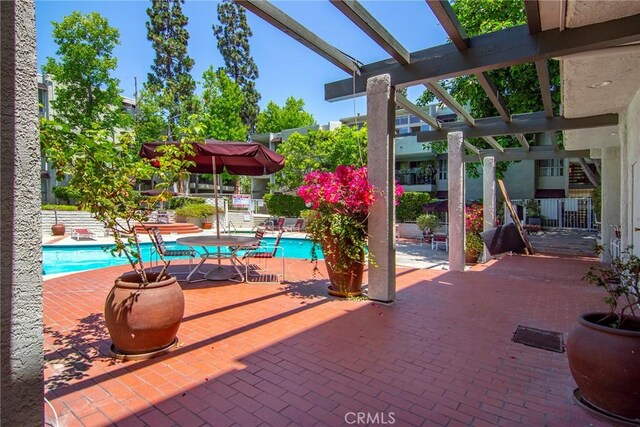 4900 Overland Ave Unit 130, Culver City, CA 90230 - view of patio / terrace featuring a community pool and a pergola