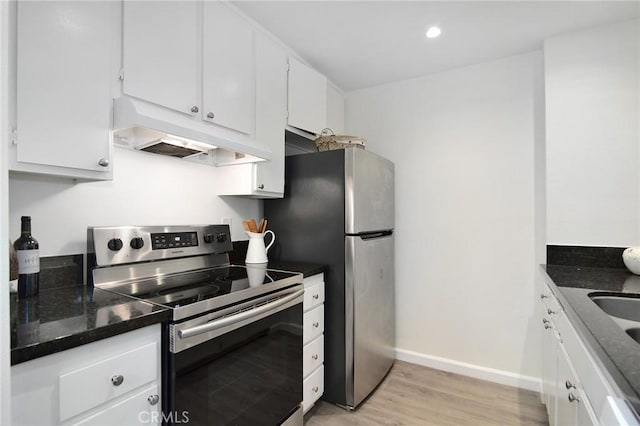 4900 Overland Ave Unit 130, Culver City, CA 90230 - kitchen featuring appliances with stainless steel finishes, under cabinet range hood, light wood finished floors, white cabinetry, and recessed lighting