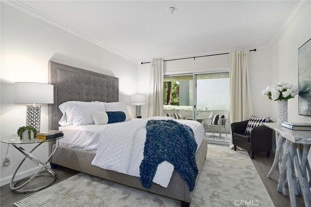 4900 Overland Ave Unit 130, Culver City, CA 90230 - bedroom with crown molding, wood finished floors, and access to outside