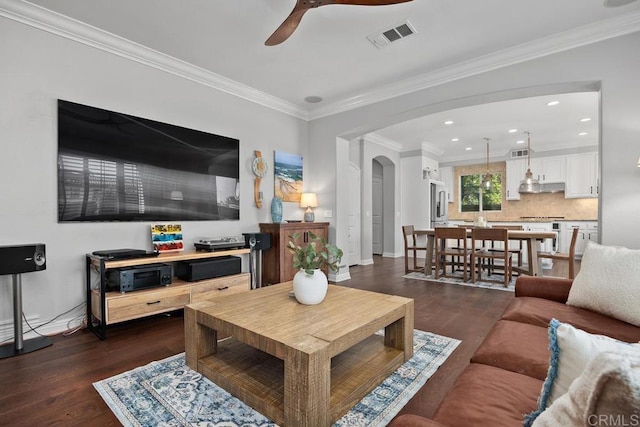 923 Citrine Way, San Marcos, CA 92078 - living room featuring a ceiling fan, dark wood-style floors, arched walkways, ornamental molding, and recessed lighting