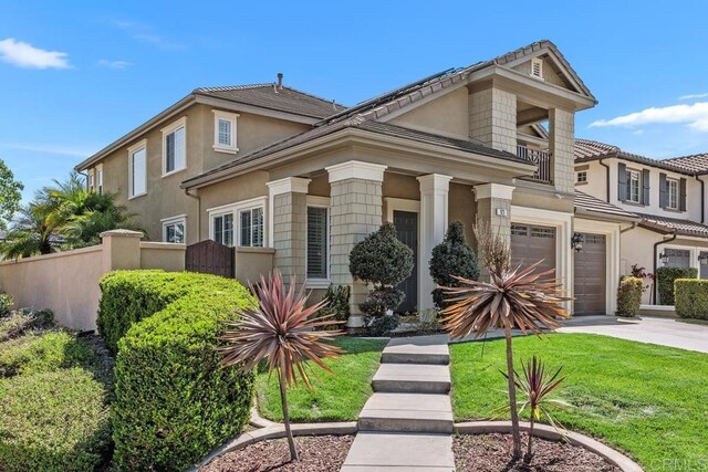 923 Citrine Way, San Marcos, CA 92078 - view of front facade with a balcony, an attached garage, driveway, and stucco siding