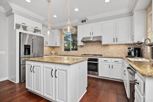 923 Citrine Way, San Marcos, CA 92078 - kitchen with appliances with stainless steel finishes, under cabinet range hood, dark wood-type flooring, a center island, and recessed lighting