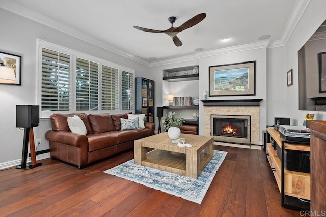 923 Citrine Way, San Marcos, CA 92078 - living room featuring ceiling fan, dark wood-style flooring, crown molding, and a fireplace