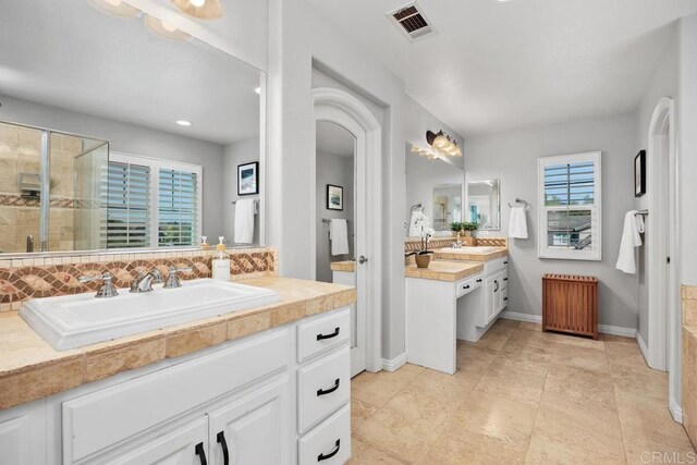 923 Citrine Way, San Marcos, CA 92078 - bathroom with a shower stall, vanity, radiator, and backsplash