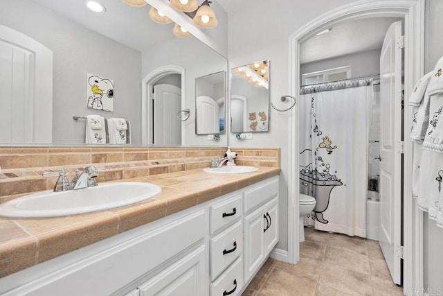 923 Citrine Way, San Marcos, CA 92078 - bathroom with double vanity, backsplash, recessed lighting, and shower / bath combo with shower curtain