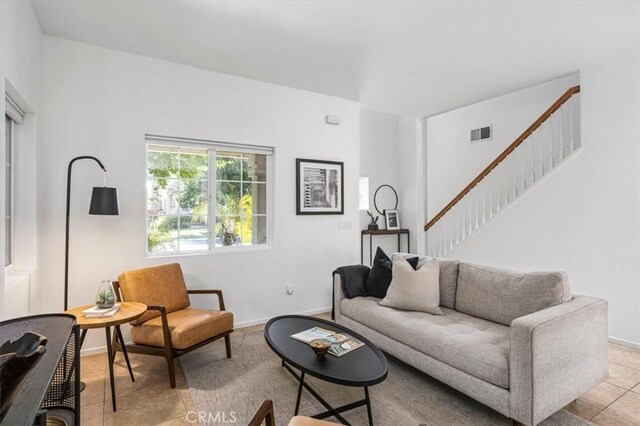 35733 Emily Ave, Murrieta, CA 92563 - tiled living area with stairs and baseboards