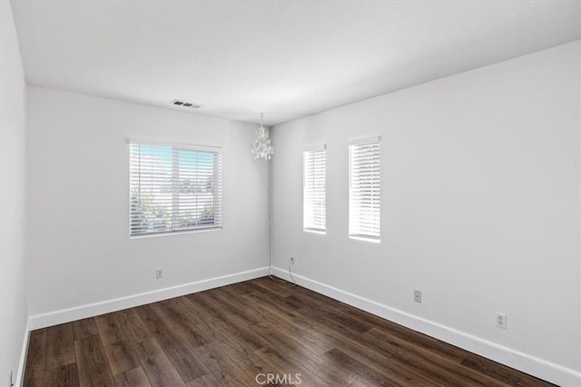 35733 Emily Ave, Murrieta, CA 92563 - spare room with a chandelier and dark wood-style floors