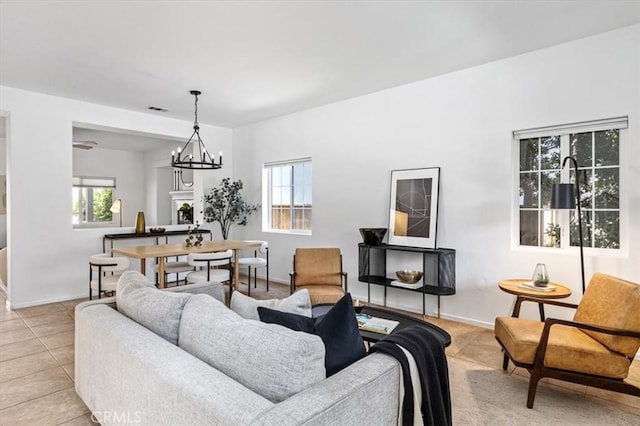 35733 Emily Ave, Murrieta, CA 92563 - living room featuring plenty of natural light, light tile patterned floors, and a chandelier
