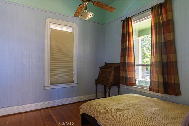 320 W 21st St, Merced, CA 95340 - bedroom with wood finished floors, multiple windows, and a ceiling fan