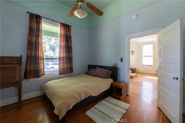 320 W 21st St, Merced, CA 95340 - bedroom with multiple windows, wood finished floors, and ceiling fan