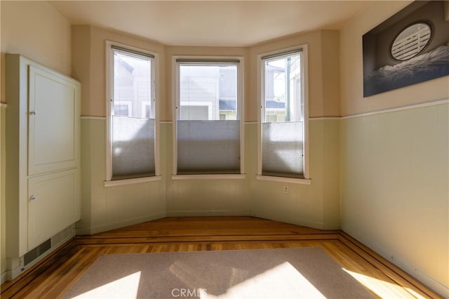 320 W 21st St, Merced, CA 95340 - spare room featuring wood finished floors and wainscoting