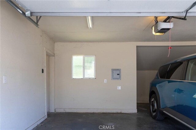 320 W 21st St, Merced, CA 95340 - garage with a garage door opener and electric panel