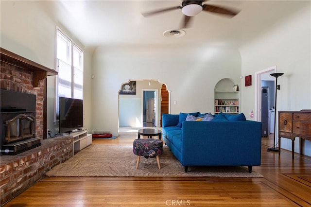 320 W 21st St, Merced, CA 95340 - living area with built in features, a ceiling fan, and wood finished floors