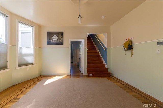 320 W 21st St, Merced, CA 95340 - unfurnished room with wood finished floors, wainscoting, and stairway