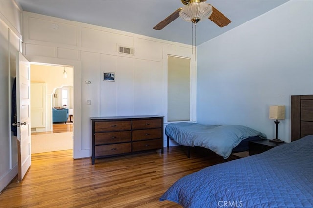 320 W 21st St, Merced, CA 95340 - bedroom with wood finished floors, a ceiling fan, and a closet